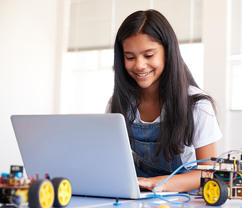 girl learning and using her computer