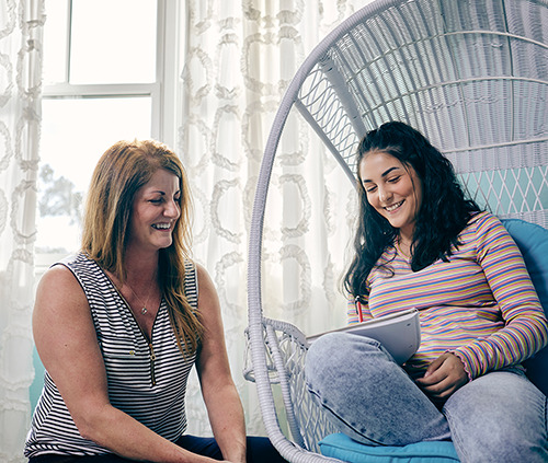 mom and daughter laughing and talking