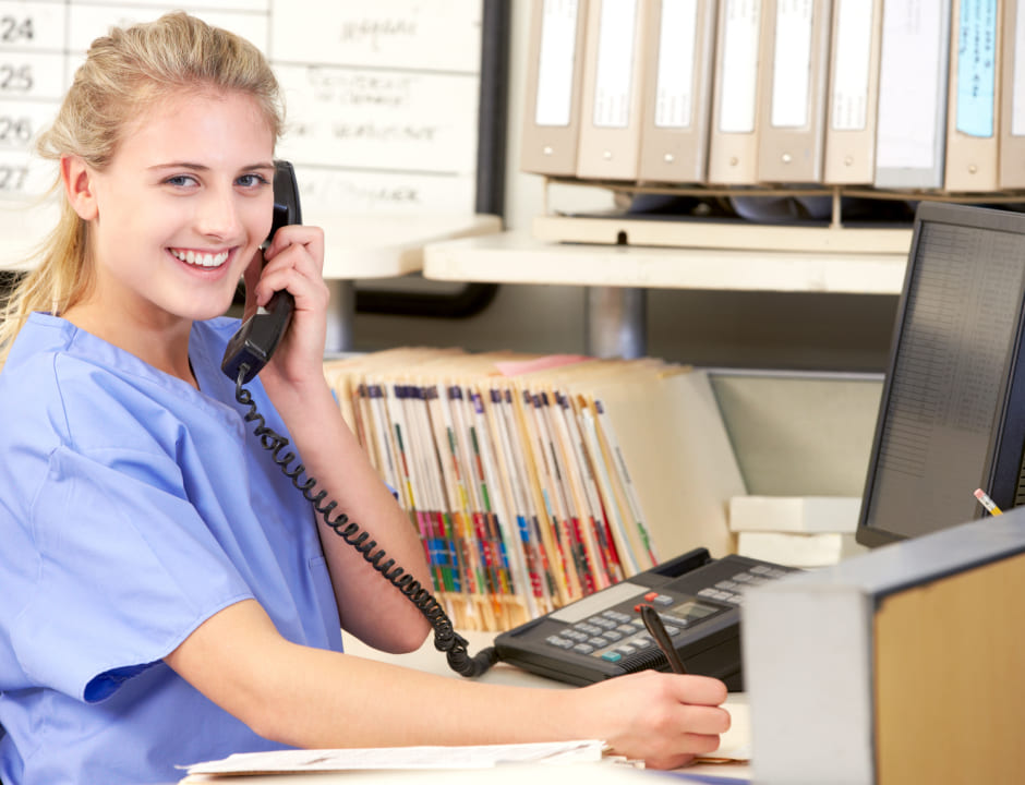 happy nurse talking on the phone