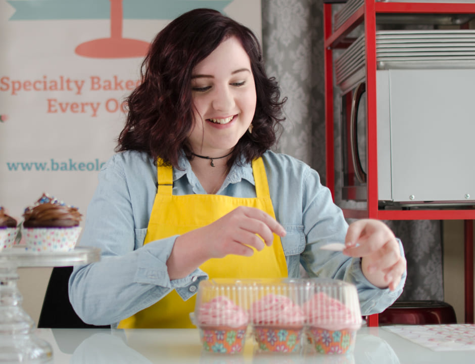 happy girl making cupcakes