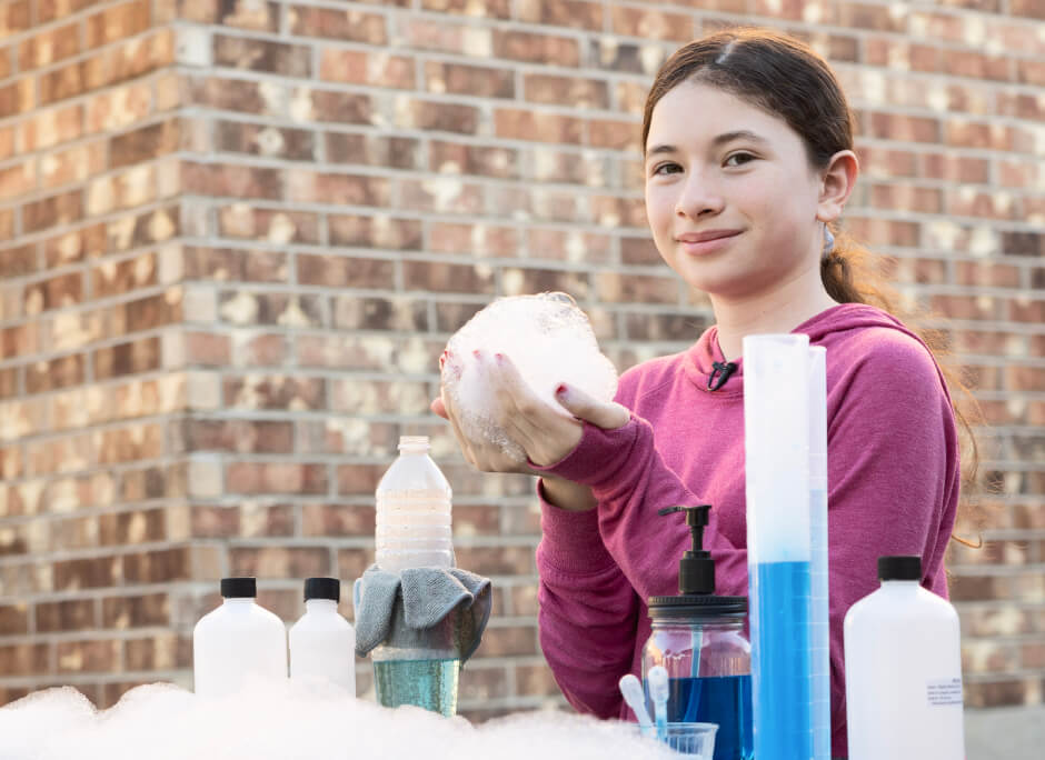 Female student doing science experiments