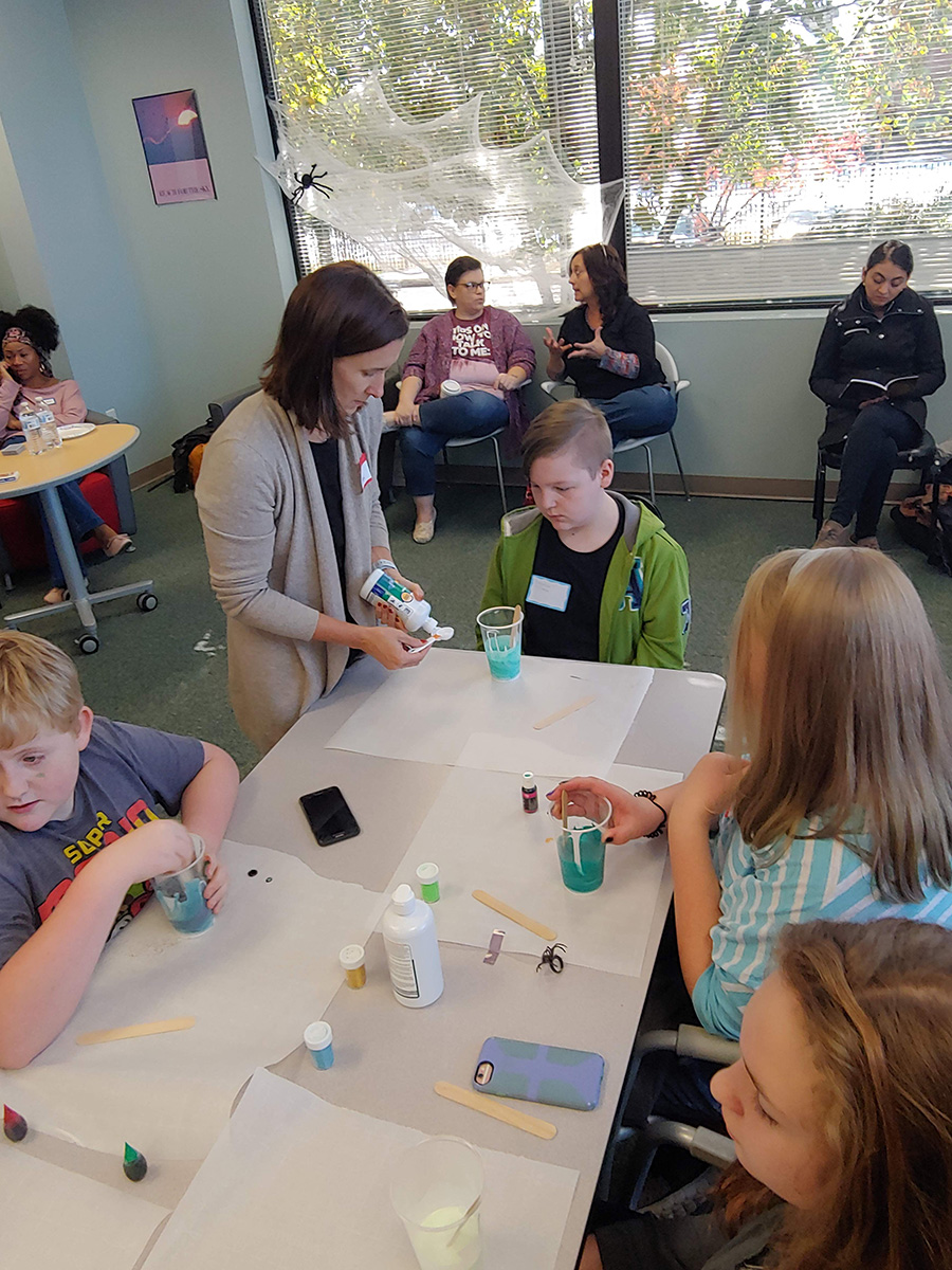 Students doing experiments in fall festival